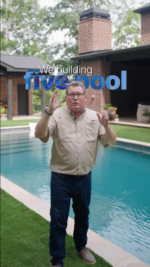 Lullwater Pools owner speaking to camera beside a finished custom pool in a Meta ad filmed by Thrivr Productions
